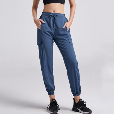 China Anti-Wrinkle Drawstring Pocket Running Jogger Pants Polyester Sports Clothes Women Sport Sport Tracksuit for sale