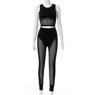 China QUICK DRY Two-Piece Set Mesh Sleeveless Crop Top Ladies Cavity Pants Tank European and American Sexy Gaiters Tops for sale