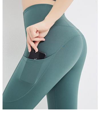 China New High Waist Antibacterial Fitness Pants With Pocket Small Yoga Feet Mesh Splice Sports Tight Yoga Pants For Women for sale