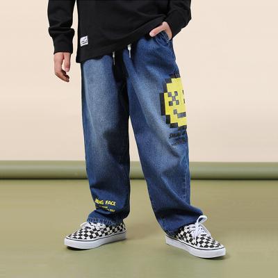 China Boy's QUICK DRY Stylish Denim Clothes Print Smile Cartoon Harem Long Jeans Spring Autumn Soft Cotton Hip Pop Drawstring Boys Loose Pants for sale