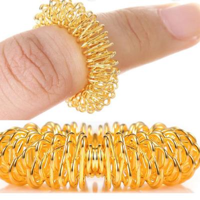 China Anillos de masaje de acupresión de acero inoxidable Masajeador de dedos para atención médica y terapia en venta