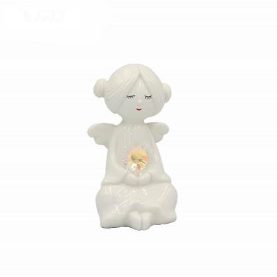 China Porcelain 2022 Wholesale Ceramic Angel LED Light Porcelain Decoration Home Vivid Nice Christmas Gifts for sale