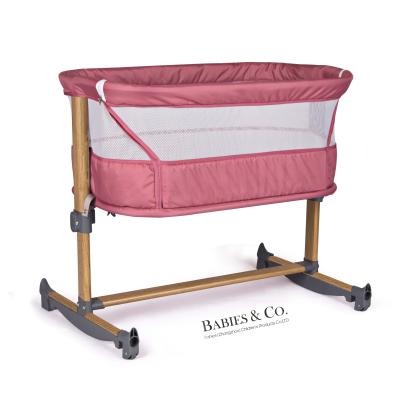 China 2021 Certified Multifunctional Height Adjustment Baby Bassinet Rock n Play Sleeper Cradle for sale