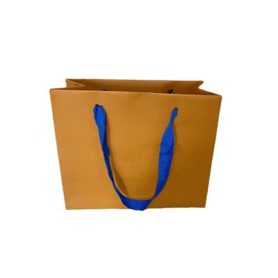 China Handled Bag Paper Clothing Gift Corporate Advertising Portable Paper Packaging Bags for sale