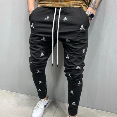 China New fashion QUICK DRY embroidery hip-hop muscle Self-cultivation trend sports feet zipper pants men's casual jeans for sale