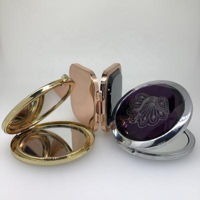 China Magnifying Double Sided Compact Mirror Around Folding Mini Pocket Mirror Portable Makeup Mirror for sale