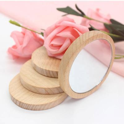 China Logo Pattern Customized Outdoor Portable Double Sided Mini Round Pocket Wooden Mirror for sale