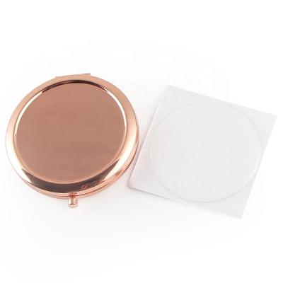 China Round Rose Gold Metal Cosmetic Pocket Magnifying Mirror With Clear Domed Epoxy Sticker for sale