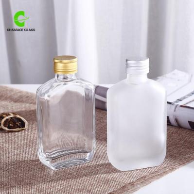 China 100ml Beverage Glass Bottle Liquor Bottles Clear With Aluminum Caps for sale