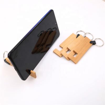 China 2021 China Mobile Phone Stands Hot Selling Fancy Natural Wooden Bamboo Stand Mobile Phone Stand for sale