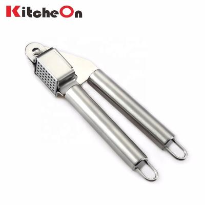 China Professional wholesale viable stainless steel garlic press with handle loops for sale