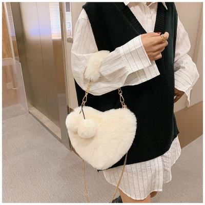 China Wholesale Soft Heart Shape Furry Cute Winter Faux Fur Colorful Purses Handbags Purses For Women for sale