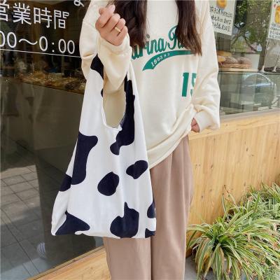 China Black And White Korean Cow Pattern Shoulder Bag Central Institute Of Statistics Student Shopping Purse New High Quality Corduroy Bag for sale