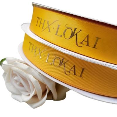 China Polyester Ribbon Viable Luxury Printed Gold Foil Printed Grosgrain Logo Customized Printed Satin Ribbon New 2023 Ribbon For Graduation for sale