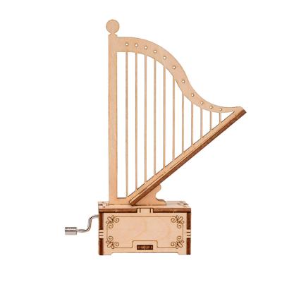 China Hot Selling Toy Amazon Model Wooden Craft Diy Gift Assemble Harp Shape Wooden Music Box Hand Crank for sale