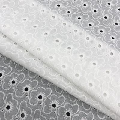 China Wrinkle Resistant Summer Pure Cotton Lace Fabric Making Embroidery Women's Cotton Skirt Apparel Wedding Dress DIY Fabric Hollow Fabric for sale