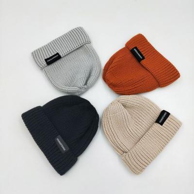 China COMMON 100% Acrylic Custom Adults Plain Toque Knitted Label Woven Beanie for sale