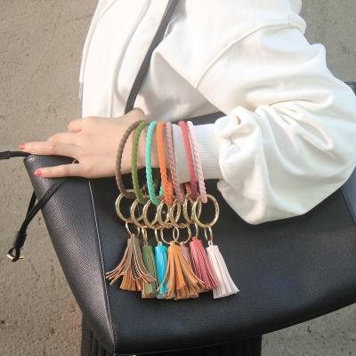 China TRENDY Soft Sc Twist Silicone Wristband Key Chain Bracelet Tassel Pendant For Women Girls Fashionable Car Bag Decor Key Chain Accessories for sale