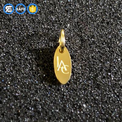 China FASHIONABLE Wholesale Punch Hole Bracelet Charms Silver Tiny Jewelry Tags With Custom Logo for sale