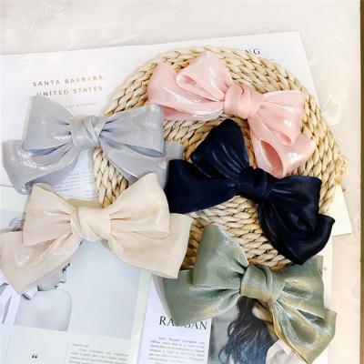 China New Fashion Solid Color Bow Spring Clip Headdress Ladies Luminous Silk Hairpin Large for sale