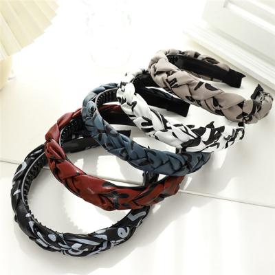 China Wholesale fashion graffiti leather hand - woven braid headband girl headdress non-slip fashion for sale