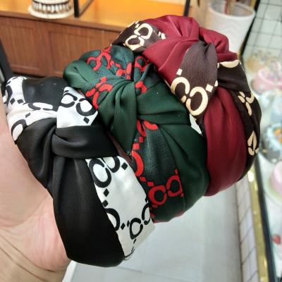 China Fashion Hair Accessories Personality Blow Color Headband Fashion Printing Female Designer Headband for sale