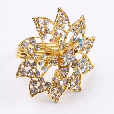 China Stocked Metal Gold Plated Bling Flower Napkin Ring For Wedding Tables for sale