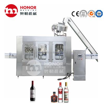 China Food Honor Machine Glass Bottle Alcohol Beer Wine Drinks Filling Packing Machine Line for sale