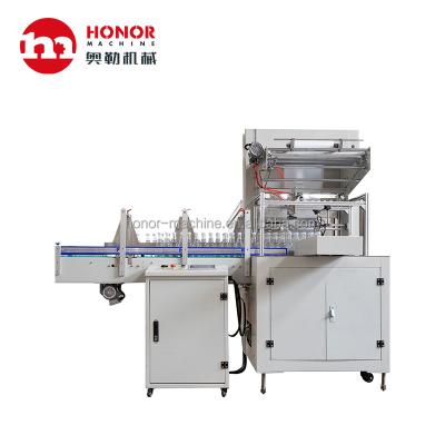 China Automatic Food Shrink Wrapping Machine Shrink Paper Wrapping Machine For Small Bottle for sale