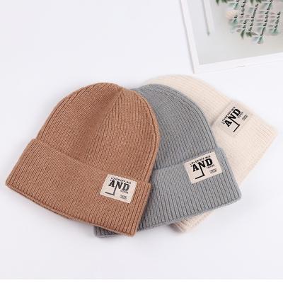 China COMMON High Quality Winter Warmth Hats Thick Woolen Knitted Women Hat Winter  Beanie Hats With Pom for sale