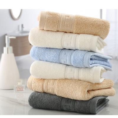 China Compressed Weighted Pure Absorbent High And Soft Jacquard 100% Cotton Towel Towels 600gsm for sale