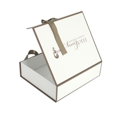 China Handmade Luxury Satin Hair Folding Customized Packaging Boxes Magnetic Shiny Lamination White Wig Bundle Package Box With White Ribbon for sale