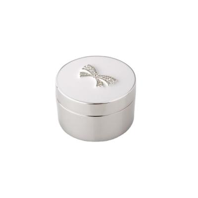 China Wedding Keepsake Gift Metal Jewelry Storage Box with Bow Icon and White Enamel Silver Keepsake Box Round Trinket Boxes for sale