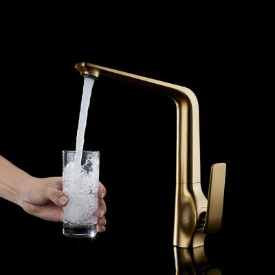 China Modern hot sale deck mounted hot and cold water mixer tap brushed gold kitchen faucet for sale