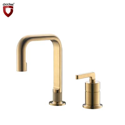 China Modern Metered Faucets Style Brass Brushed Gold 2 Hole Sink Mixer Tap Deck Mounted Basin Faucet For Bathroom for sale