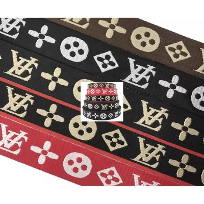 China Custom Logo Woven Jacquard Strap Webbing in Black Color for 38mm Nylon Shoulder Strap for sale