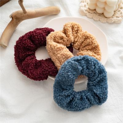 China Autumn Winter Supplier Soft Plush Lambswool Teddy Scrunchies Pom Pom Scrunchies Elastic Hair Rope Women Headband Hair Scrunchies New for sale