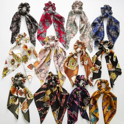 China Bulk Pink Printed Hair Scrunchies Ring Scrunchies Knot Tassel Cloth Large Fluffy Ponytail Ribbon Satin Bow Hair Scrunchies Women Headband Hair Scrunchies for sale