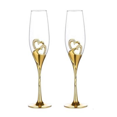 China Heart Shape Metal Base High Quality Gold Heart Shape Metal Base Crystal Sparking Glass Champagne Flutes with Gold Heart Shape Metal Base for sale