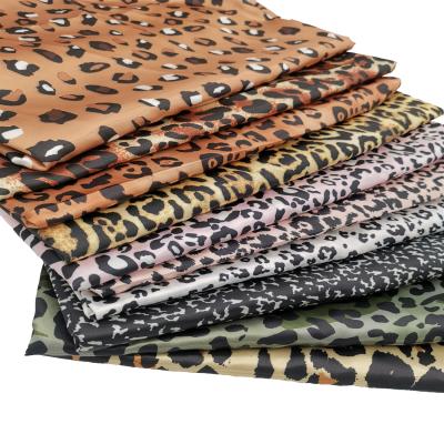 China 100% Polyester Tear-Resistant Leopard Transfer Printed Silk Like Satin Fabric Pajama Fabric for sale