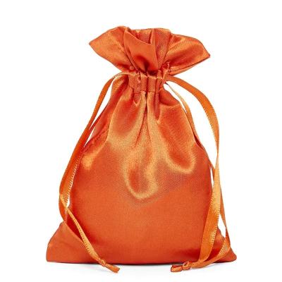 China Elegant Orange Gift Satin Silk Fabric Small Drawstring Bag For Gift Wrapping for sale