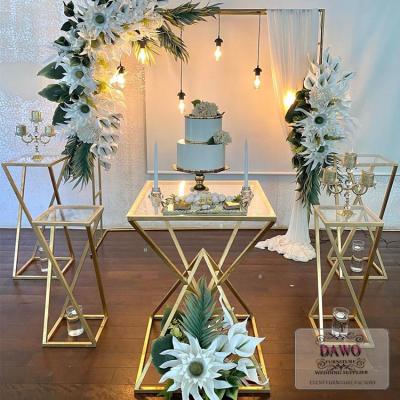 China Modern wedding accessories table modern gold stainless steel tempered glass top wedding cake table for sale