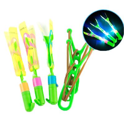 China Glow in Dark& With Sound Rocket Elastic Slingshot Big Round With Sound Whistle Flying Arrow Helicopters LED Helicopters For Kids Party Festival Fun Toys for sale