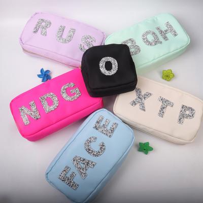 China Custom Fashion Waterproof Nylon Toiletry Bag Personalized Hot Stamping Patches Makeup Cosmetic Bag for sale