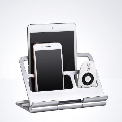 China Portable Adjustable Desktop Display Stand Storage Tablet Phone Holder For iPad Remote Control for sale