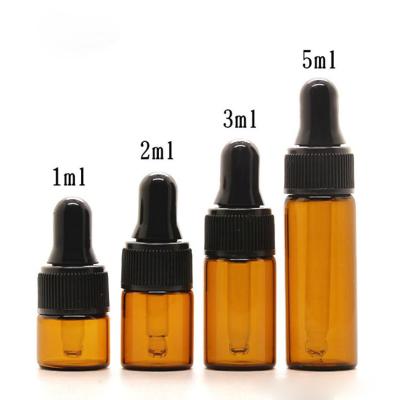 China Portable Wholesale Glass Dropper Bottles 1ml 2ml 3ml 5ml Amber Essential Oil Bottle With Black Lids DHL Free Shipping for sale