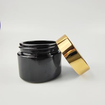 China 10g 15g 20g 30g 50g Cosmetic Black Glass Empty Cosmetic Jars With Metalized Lids for sale