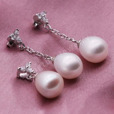 China FASHIONABLE Luxury Silver Oval Natural Freshwater Pearl Button Loose Pearl Stud Earrings for sale