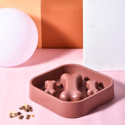 China Sustainable Dog Food Hot-selling Dog Food Bone Shaped Food Grade Plastic Anti-Clog Slow And Long Lasting Bowl for sale