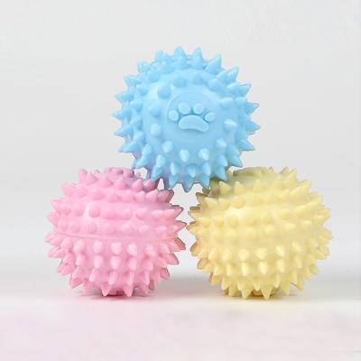 China Viable Pet Tooth Cleaner Chewing Toy TPR Paw Print Spine Ball Dog Molar Teeth Cleaning Toy for sale